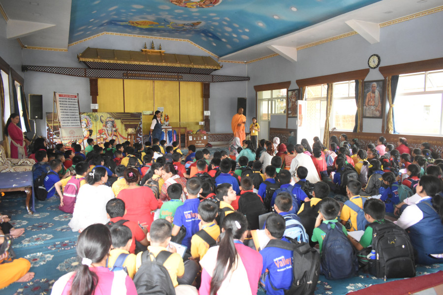 students are sitting on the floor