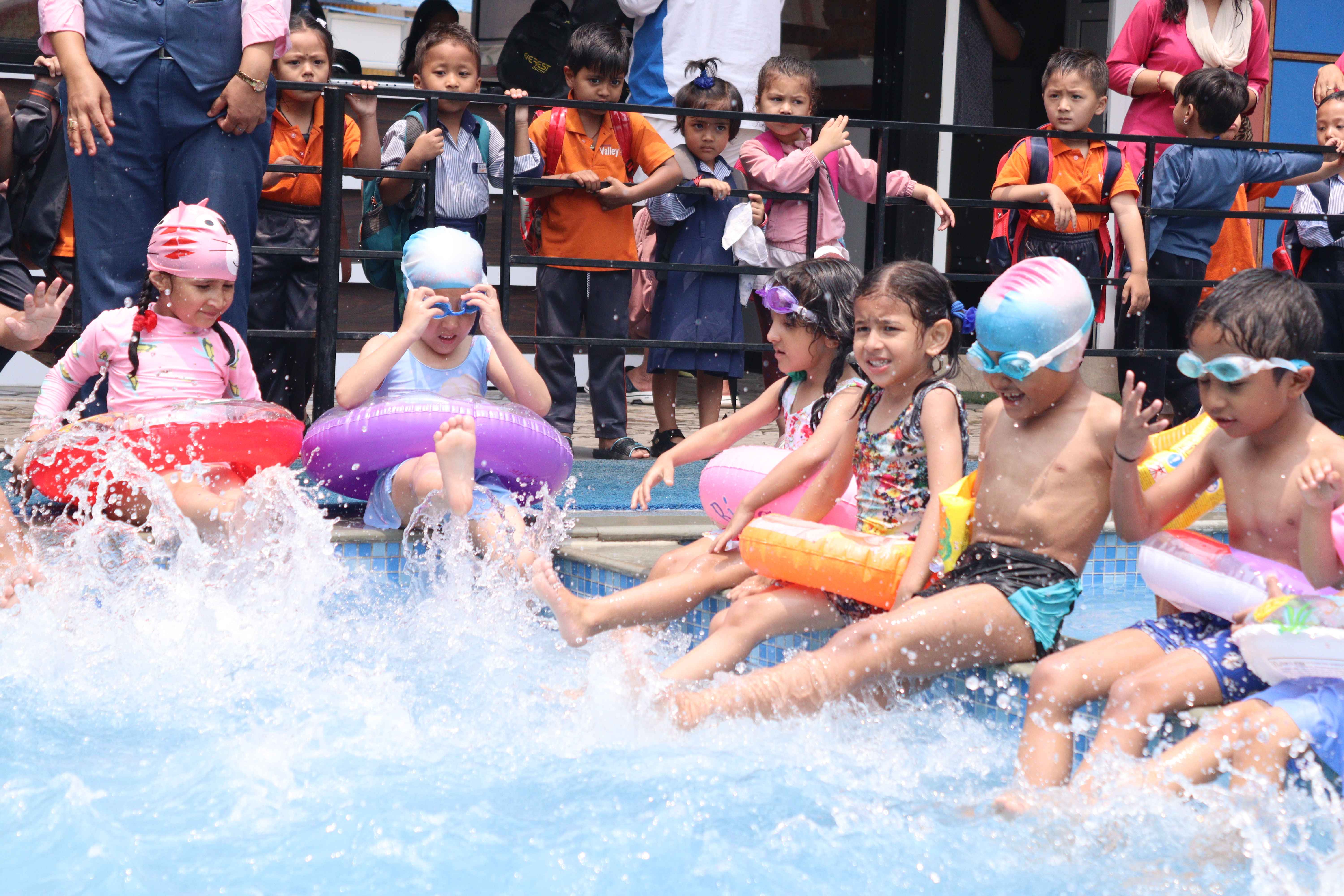 pre school children are swimming
