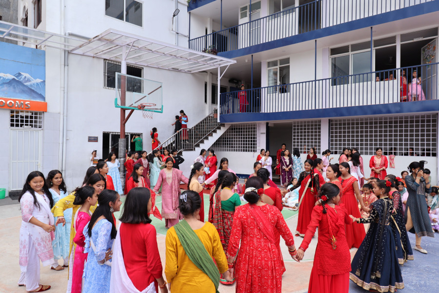 students and teacher are celebrating teej in school