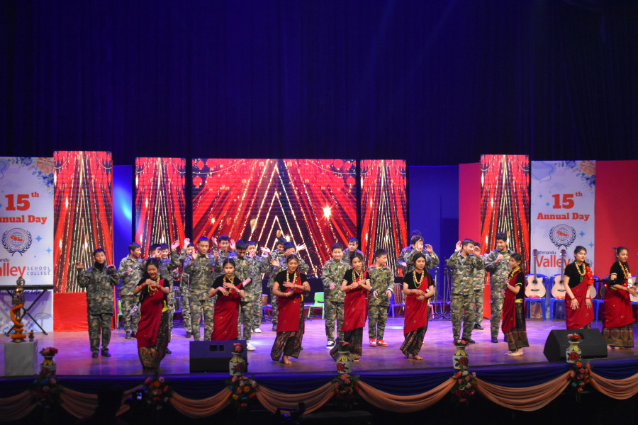 students perform dance in army dress